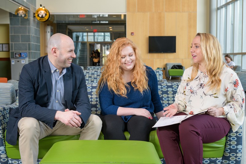 Joshua Wilson (left), assistant professor in the University of Delaware’s School of Education, with undergraduate research assistants Mckenna Winnie (center) and Ally Raiche