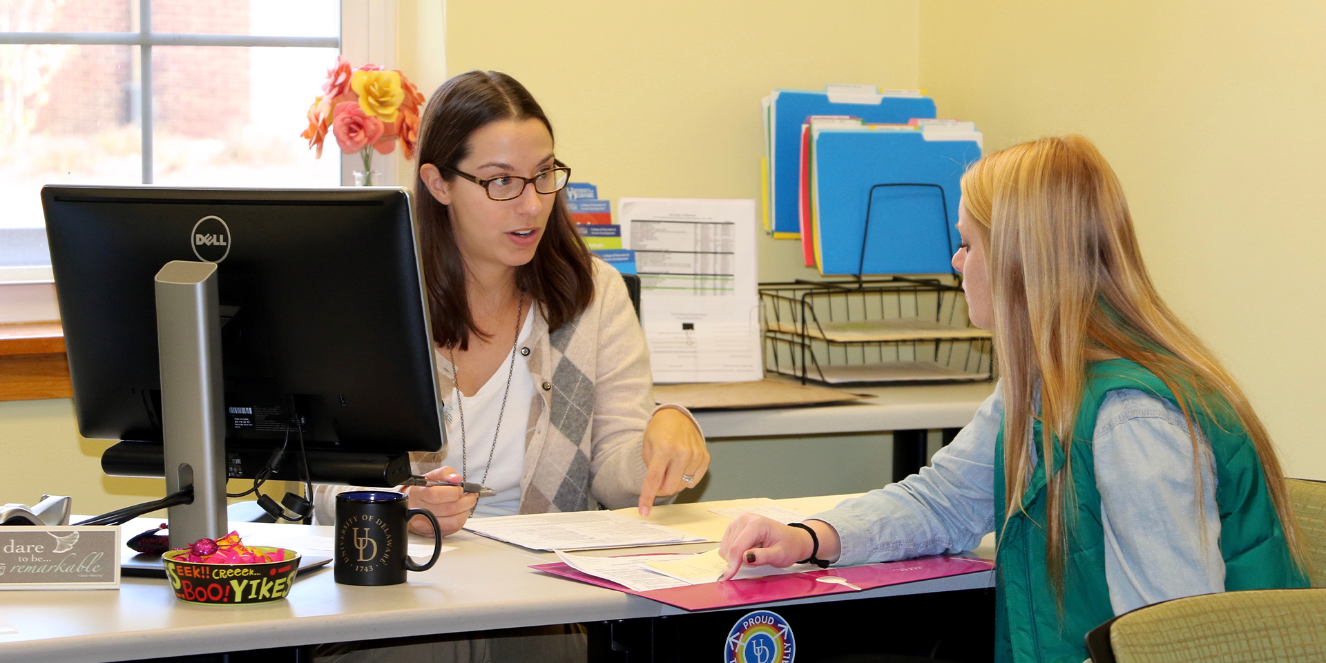 Academic advisor speaks with student