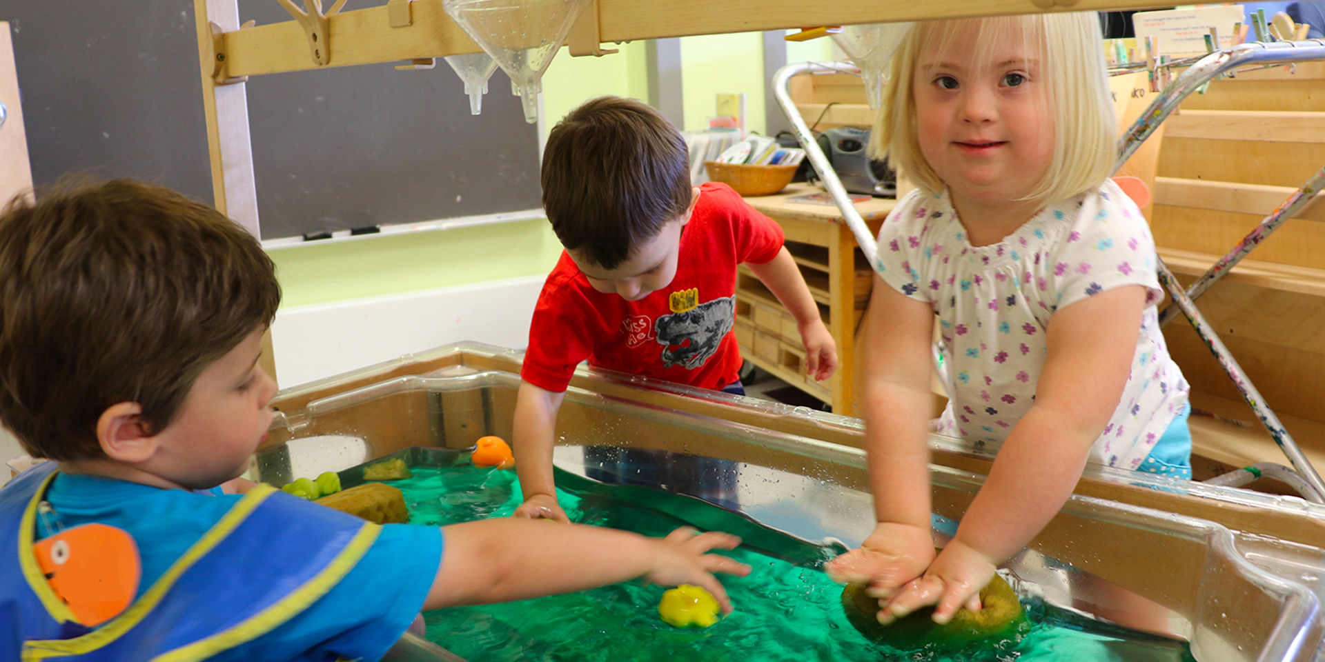 Three children participating in a lesson plan