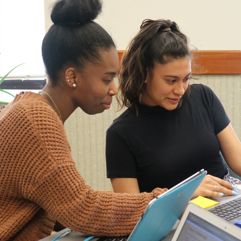 Two students working on their laptops