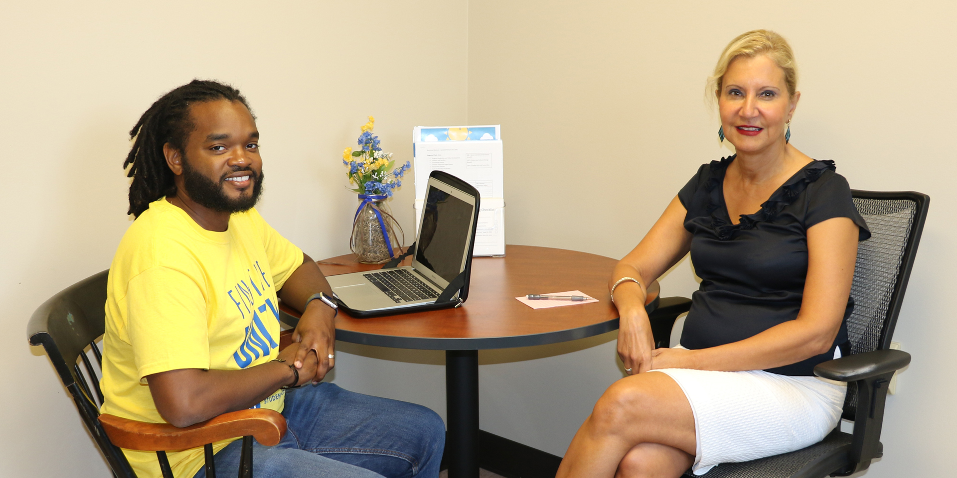 Department chair Bahira Trask talks with doctoral student