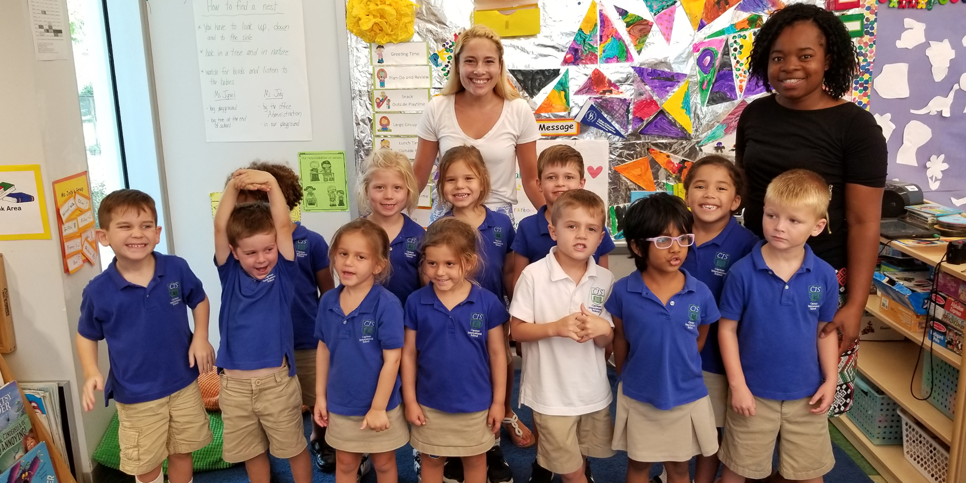 Two student teachers with their class in Grand Cayman