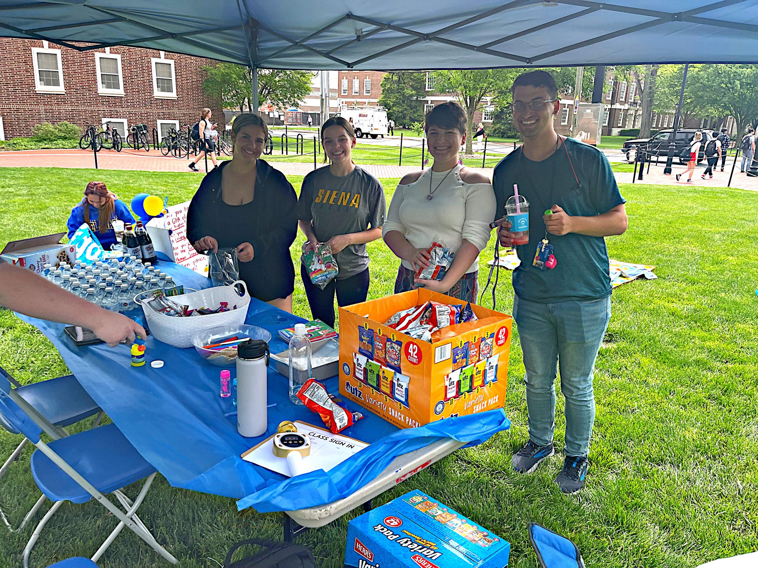 TUA members under tent on the green