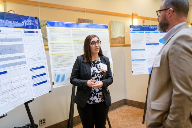 graduate student presents research to faculty at steele symposium