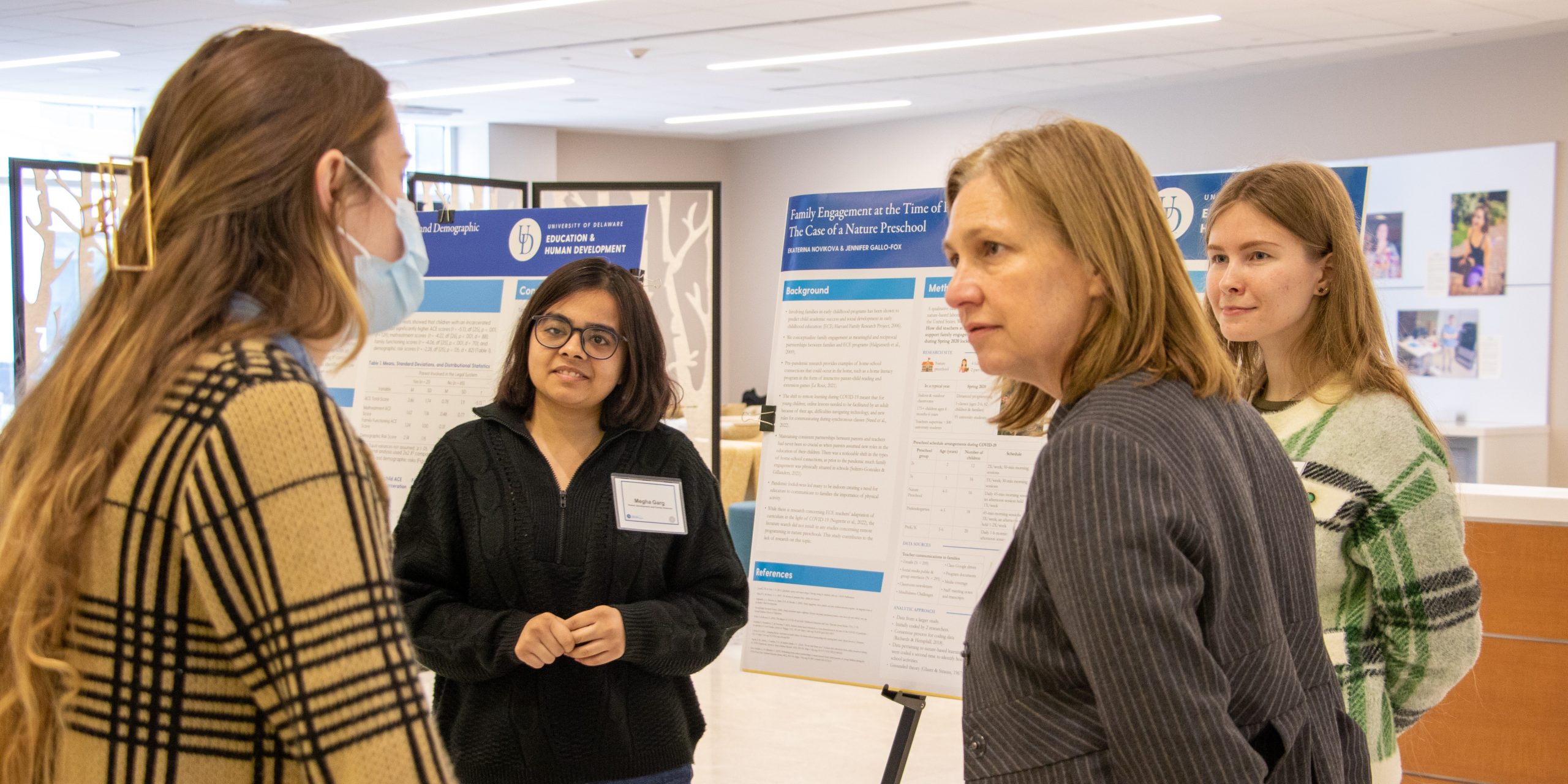Department chair Bahira Trask talks with doctoral student